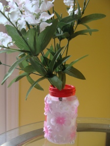 Kalie Lyn also made-over this old glass bottle with some creativity and modge podge.
